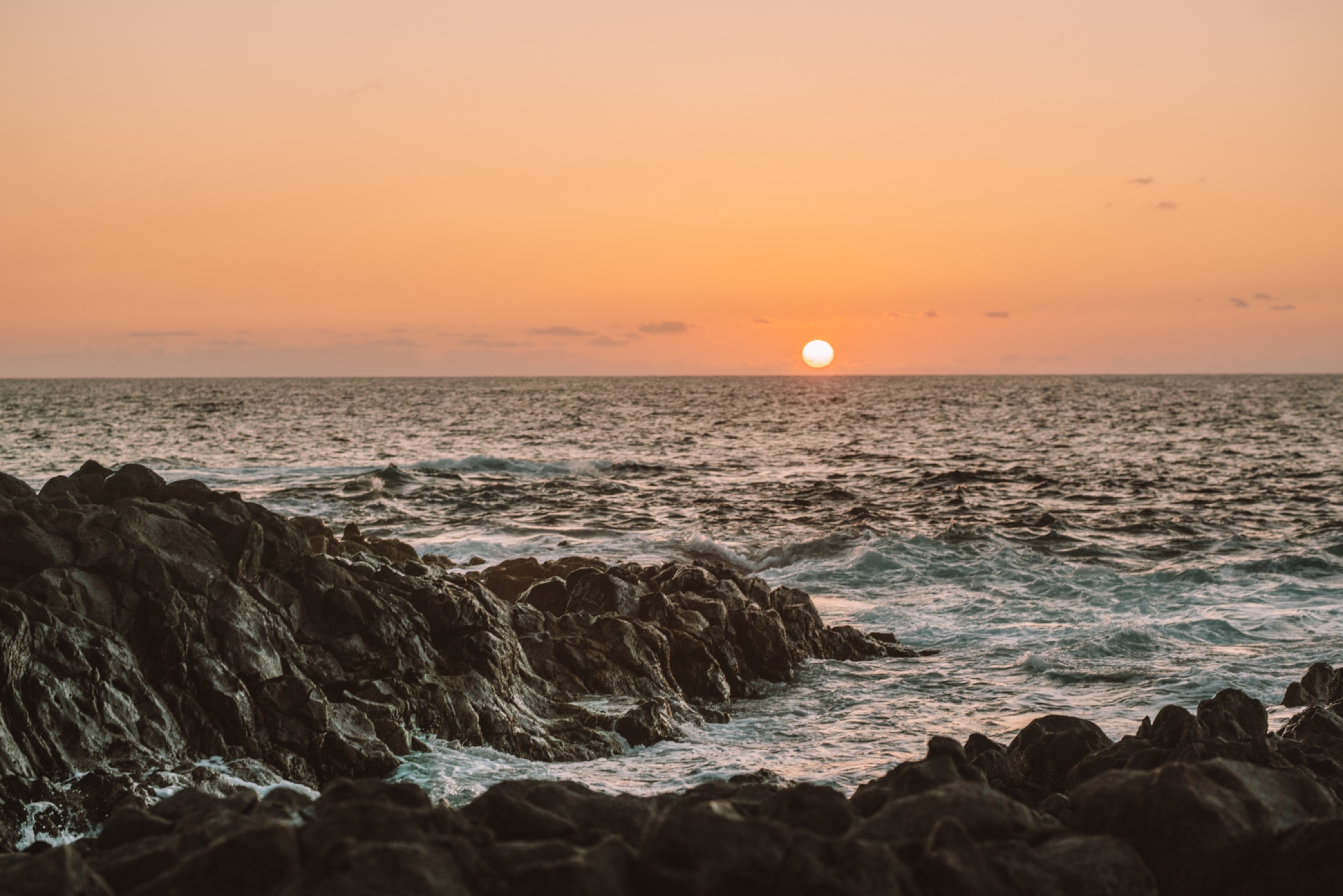 Sunset over volcanic rock and Atlantic ocean, Tenerife